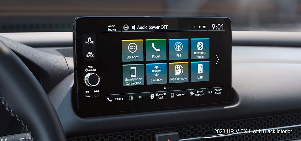 Display Audio touchscreen displaying main menu in the Honda HR-V EX-L 2023 with black interior.